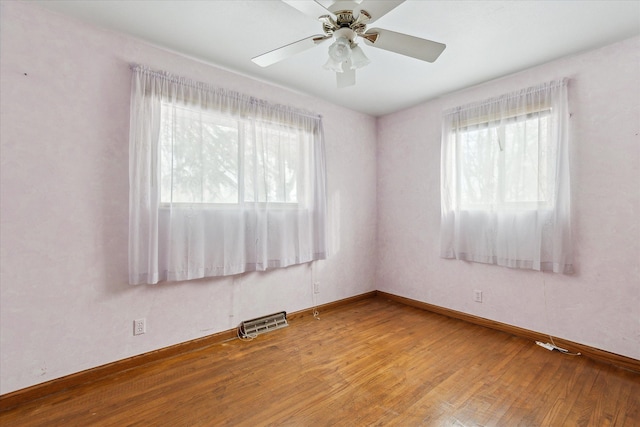 unfurnished room with hardwood / wood-style floors and ceiling fan