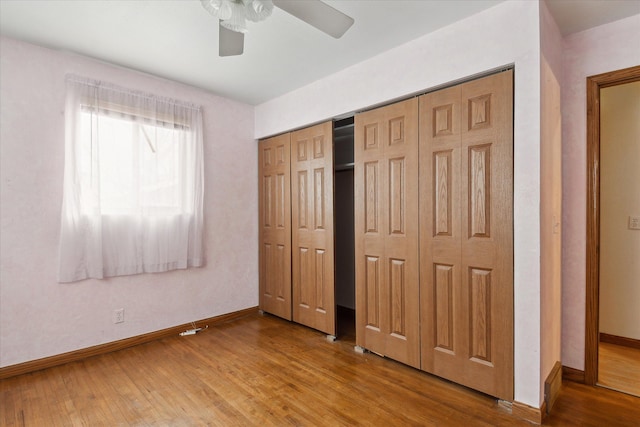 unfurnished bedroom featuring hardwood / wood-style flooring and ceiling fan