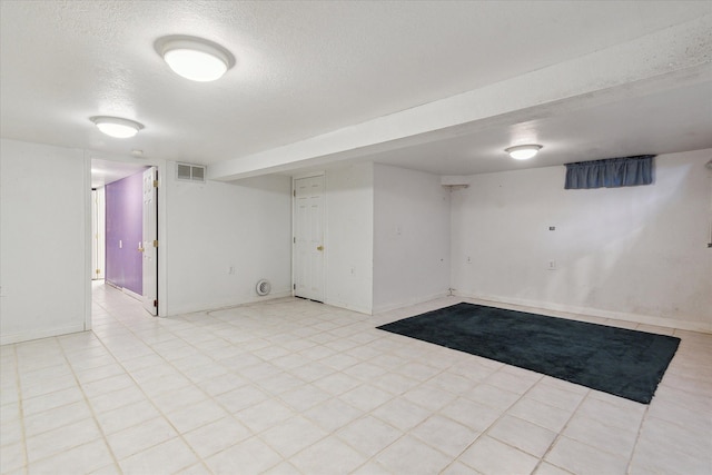 basement with a textured ceiling