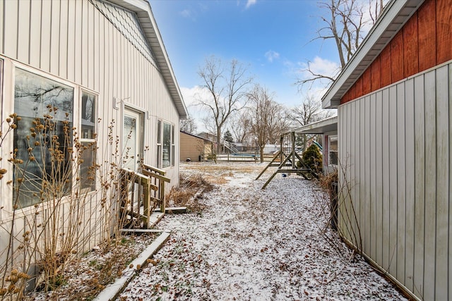 view of yard layered in snow