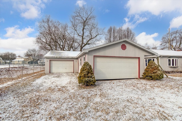 view of snow covered garage