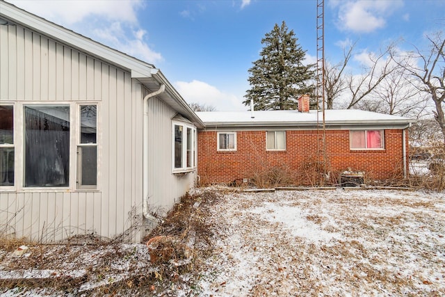 view of snow covered property