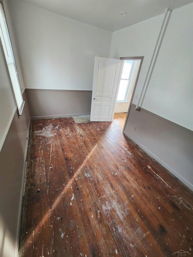 unfurnished room featuring dark hardwood / wood-style flooring