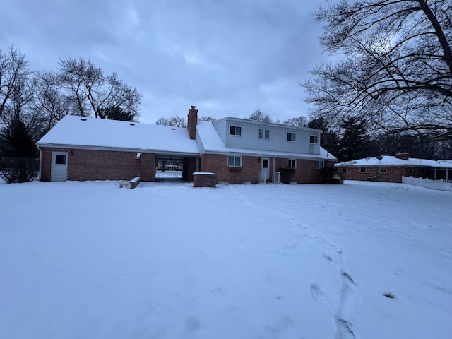 view of snow covered house