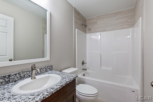 full bathroom with vanity,  shower combination, and toilet