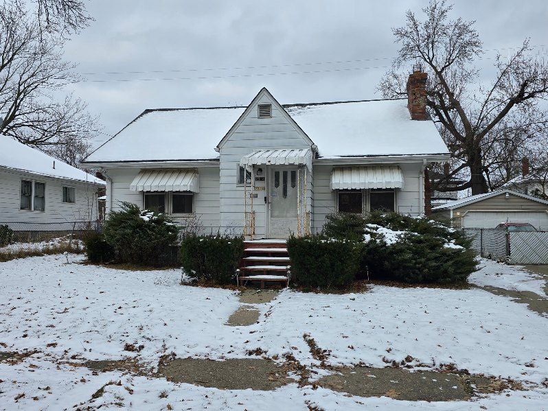 bungalow featuring a garage