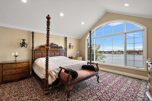 bedroom with a water view, ornamental molding, vaulted ceiling, and multiple windows