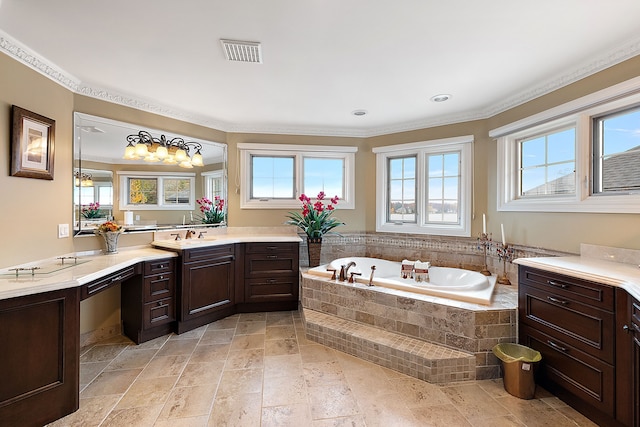 full bathroom featuring stone finish floor, a garden tub, visible vents, and vanity