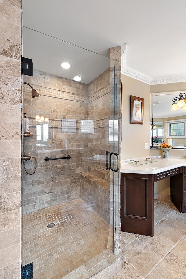 full bath featuring a stall shower, vanity, and stone tile floors