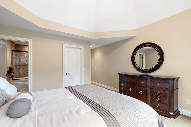 bedroom with carpet and ensuite bath