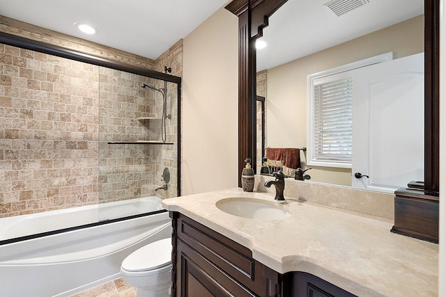 full bath with shower / bath combination with glass door, recessed lighting, visible vents, toilet, and vanity