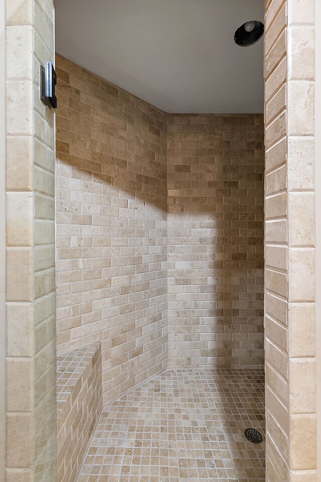 bathroom with tiled shower