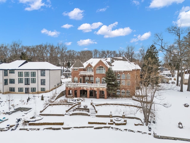 view of snow covered house