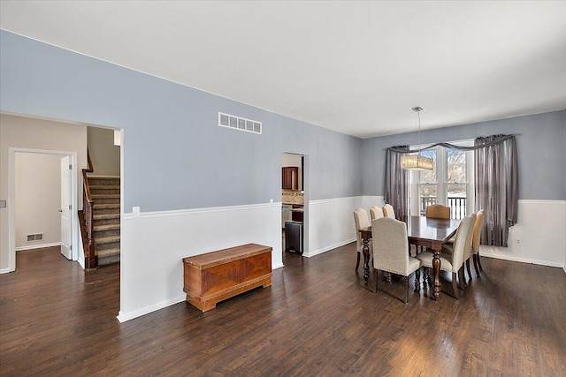 dining area with dark wood-type flooring