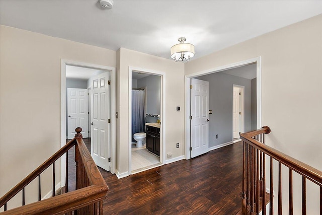 corridor with dark wood-type flooring