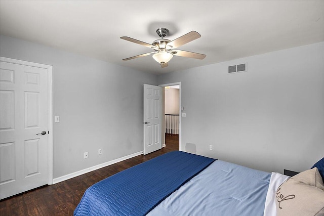 bedroom featuring dark hardwood / wood-style floors and ceiling fan