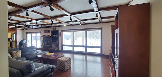 living room with coffered ceiling, hardwood / wood-style floors, and beam ceiling