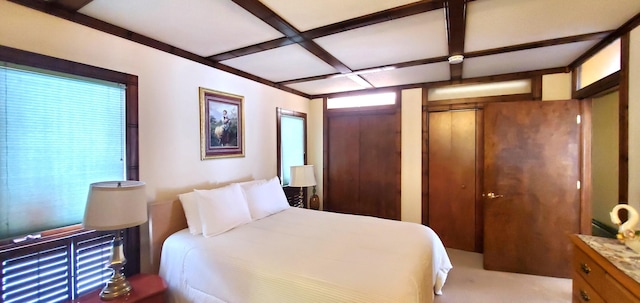 bedroom with beamed ceiling and coffered ceiling