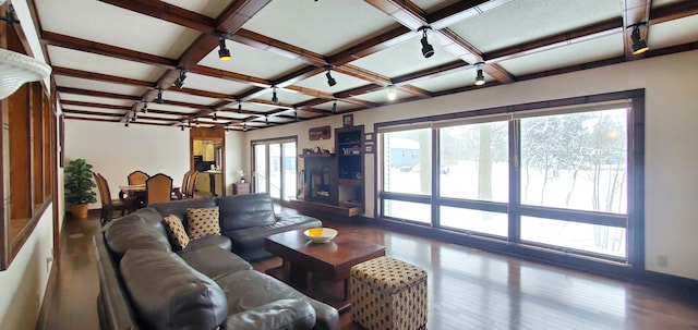 living room with wood-type flooring, coffered ceiling, and beam ceiling