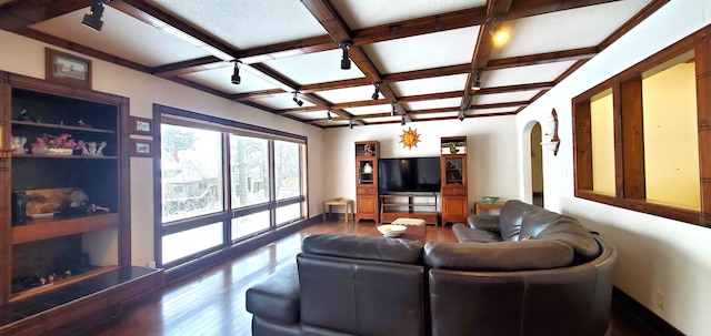 living room featuring coffered ceiling, hardwood / wood-style flooring, and beamed ceiling