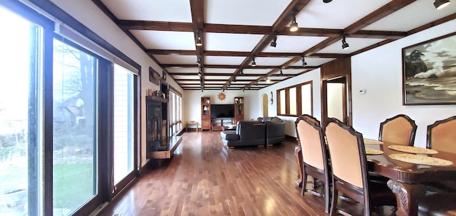 dining area featuring coffered ceiling, dark wood-style floors, and beam ceiling