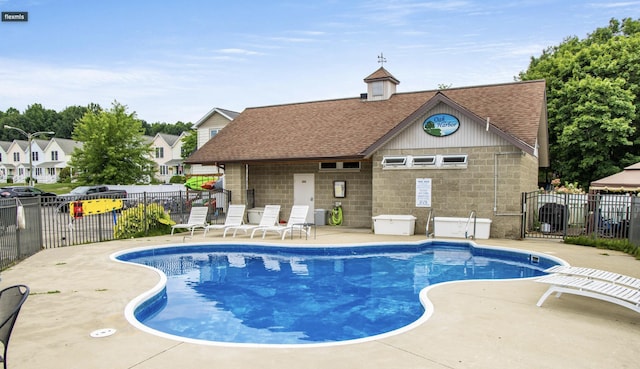 view of pool featuring a patio area