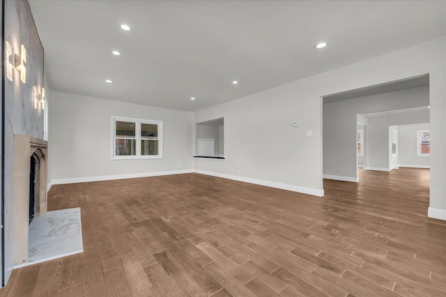 unfurnished living room with light hardwood / wood-style flooring