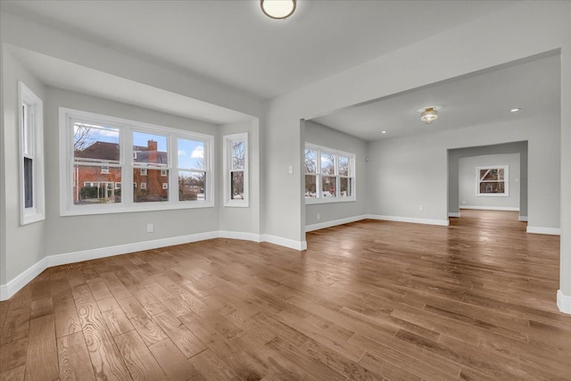 unfurnished living room featuring hardwood / wood-style floors