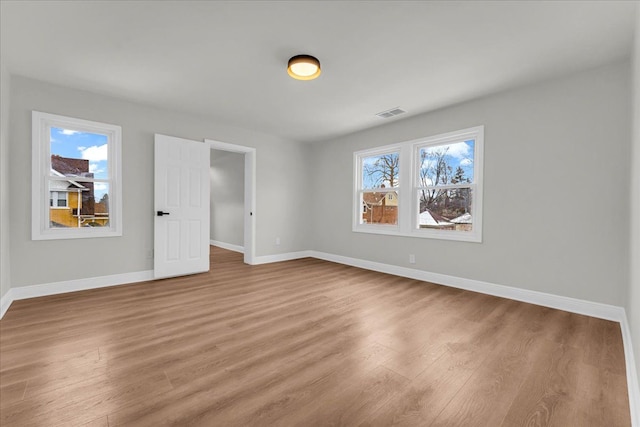 spare room featuring light hardwood / wood-style floors