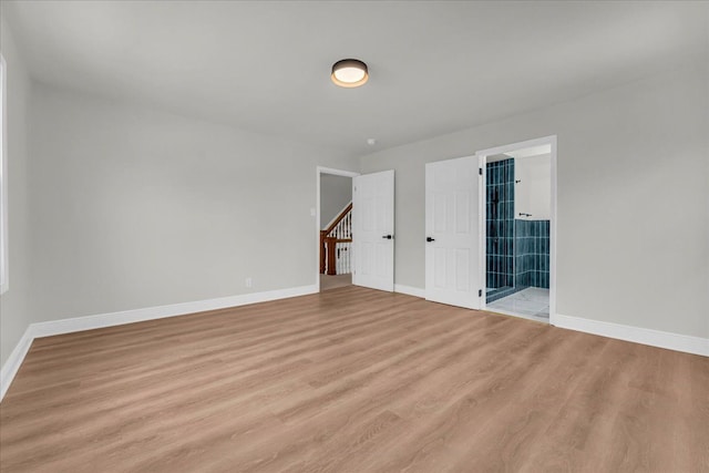 spare room featuring light hardwood / wood-style floors