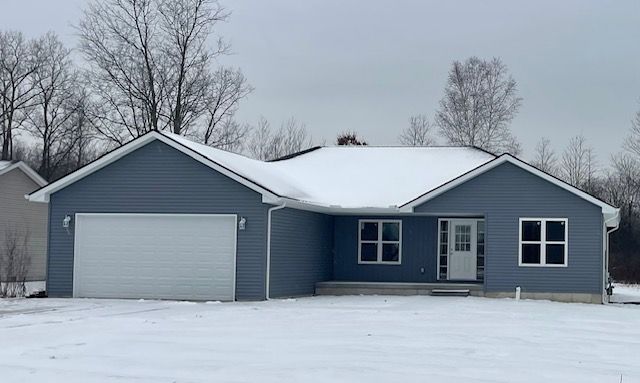 single story home featuring a garage