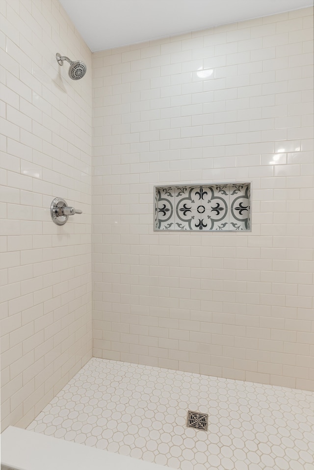 bathroom with a tile shower