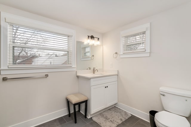 bathroom with vanity, tile patterned floors, and toilet