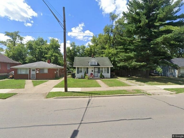 view of front of home with a front yard