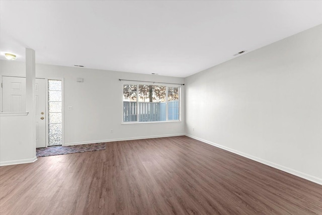 empty room featuring dark hardwood / wood-style floors