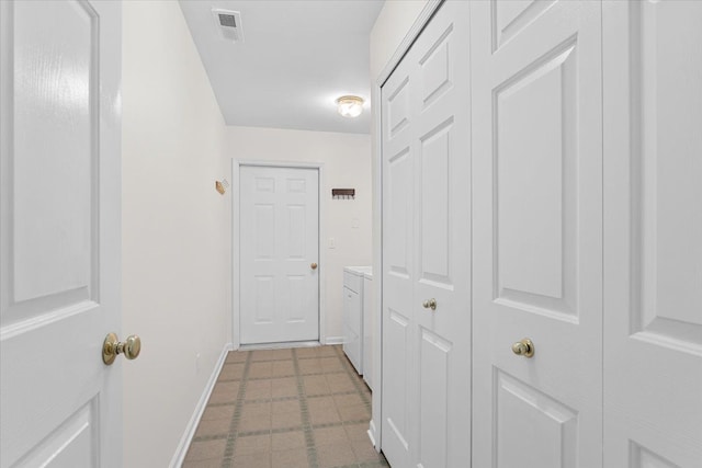 hall with separate washer and dryer