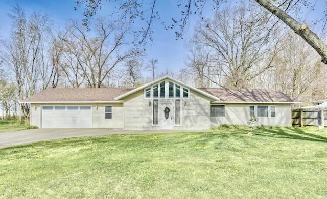 ranch-style home featuring a garage and a front yard