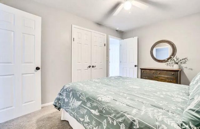 bedroom featuring carpet, ceiling fan, and a closet