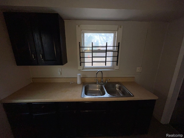 19254 Keystone St, Detroit, MI 48234 - kitchen featuring dark cabinetry and light countertops