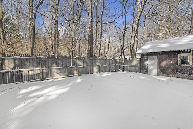 view of yard layered in snow