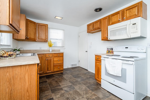 kitchen featuring sink and white appliances