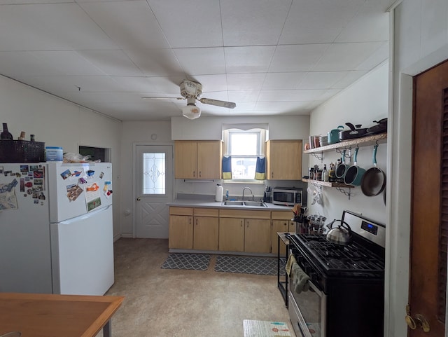 kitchen featuring sink, ceiling fan, and appliances with stainless steel finishes