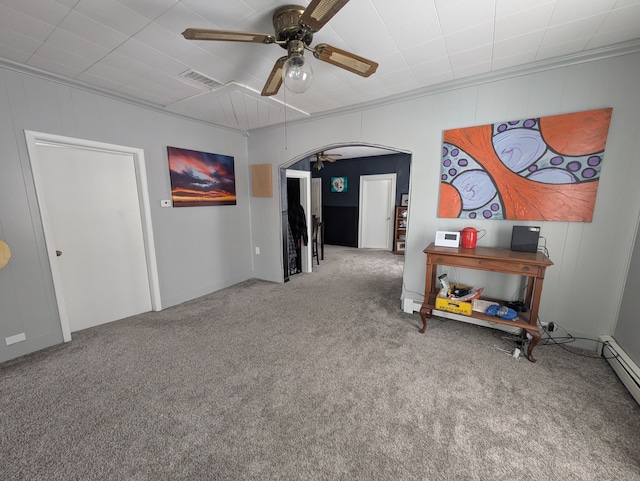 carpeted empty room featuring ceiling fan, ornamental molding, and a baseboard radiator