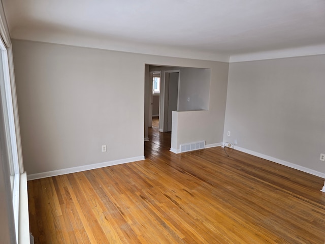 empty room featuring hardwood / wood-style flooring