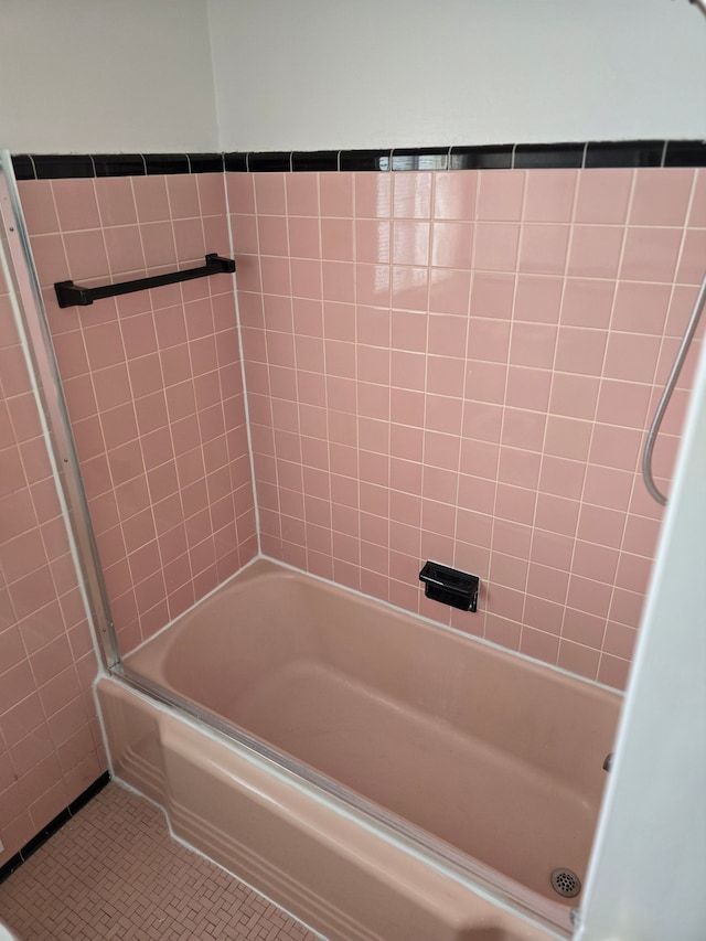 bathroom with bathtub / shower combination and tile patterned floors