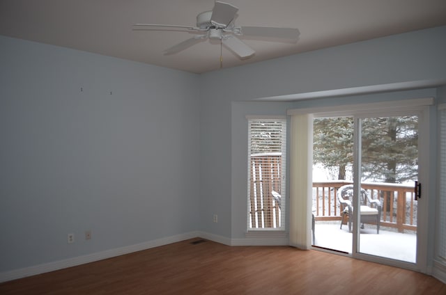 unfurnished room featuring hardwood / wood-style flooring and ceiling fan