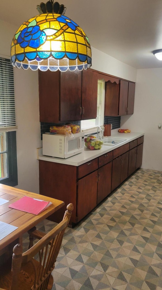 kitchen with sink and dark brown cabinets