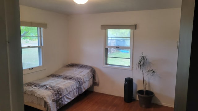 bedroom featuring dark hardwood / wood-style flooring