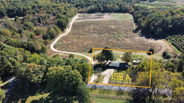 birds eye view of property featuring a rural view