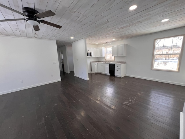 unfurnished living room with dark hardwood / wood-style flooring, a wealth of natural light, sink, and wooden ceiling